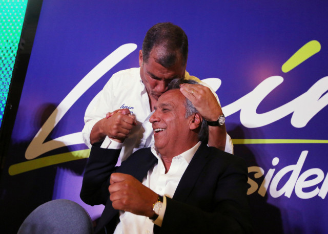 Ecuador's President Rafael Correa kisses Lenin Moreno, candidate of the ruling PAIS Alliance Party, at the Hotel Colon during the presidential election in Quito